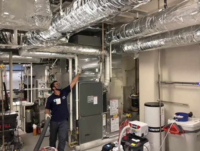 Hanover Air Duct Cleaning specialist performing thorough furnace duct cleaning in a Hanover residence
