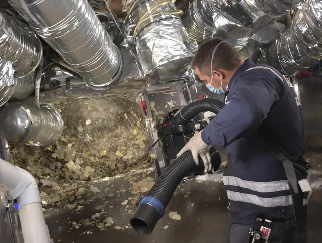 Hanover Air Duct Cleaning specialist operating negative pressure cleaning equipment for thorough duct maintenance in Hanover