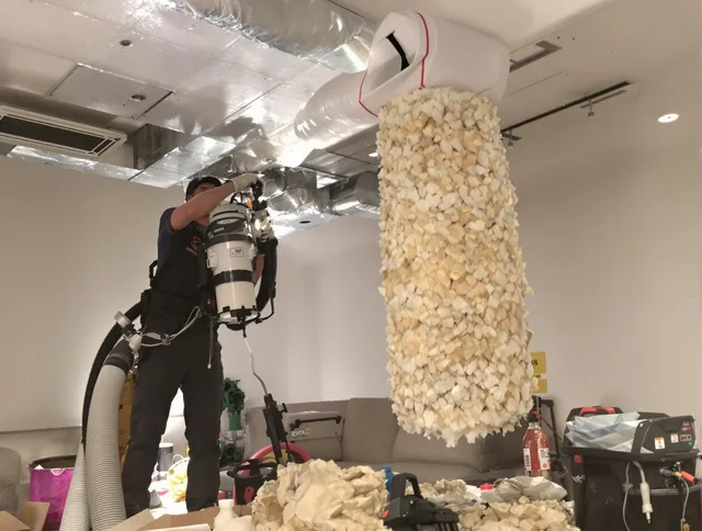 Hanover Air Duct Cleaning technician performing precision vacuum insulation removal in a residential property in Hanover