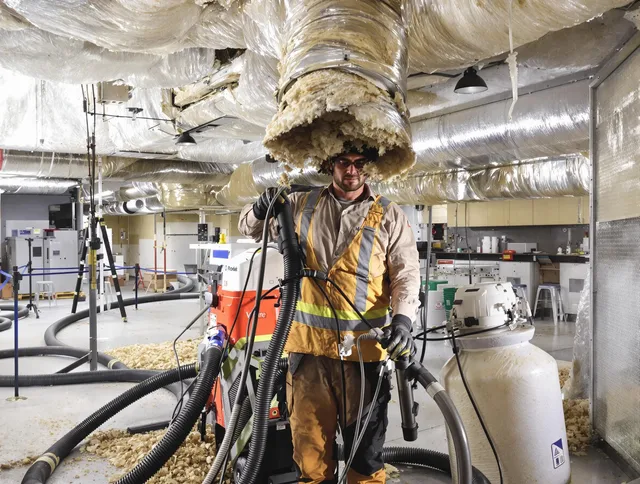 Professional vacuum insulation removal by Hanover Air Duct Cleaning expert in Hanover